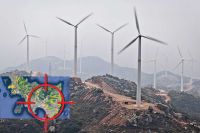 Photo of mountain full of wind turbines